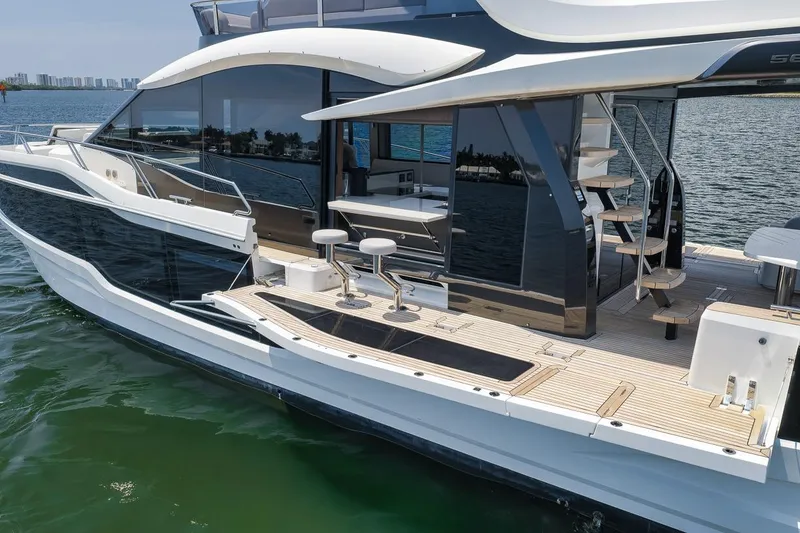 Slide: The Image of Luxury 2022 Galeon 560 Fly yacht with sleek design and modern amenities on the water. - 29