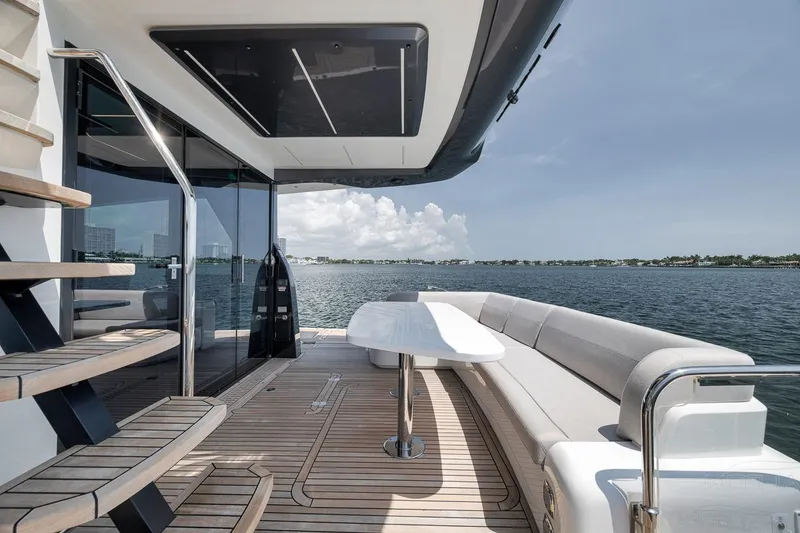 Slide: The Image of Luxurious 2022 Galeon 560 Fly yacht deck with seating and ocean view. - 95