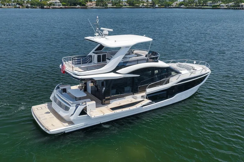Slide: The Image of Luxury 2022 Galeon 560 Fly yacht cruising on serene waters. - 10