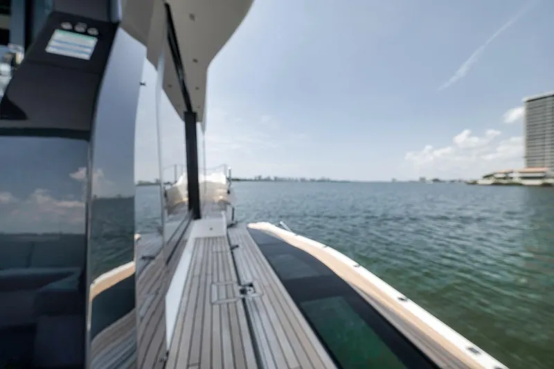 Slide: The Image of 2022 Galeon 560 Fly yacht deck with ocean view and modern design. - 87