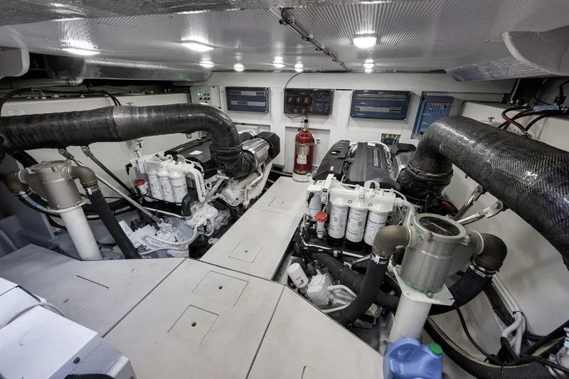 Slide: The Image of Engine room of 2022 Galeon 560 Fly yacht, featuring dual engines and advanced systems. - 98