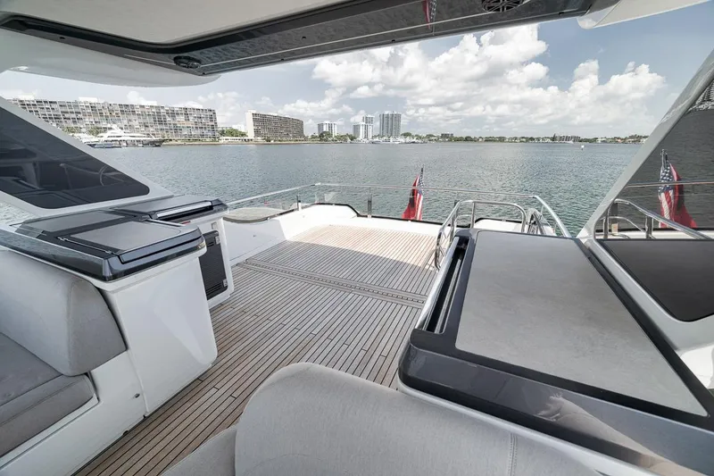 Slide: The Image of Luxurious 2022 Galeon 560 Fly yacht deck with waterfront cityscape view. - 85