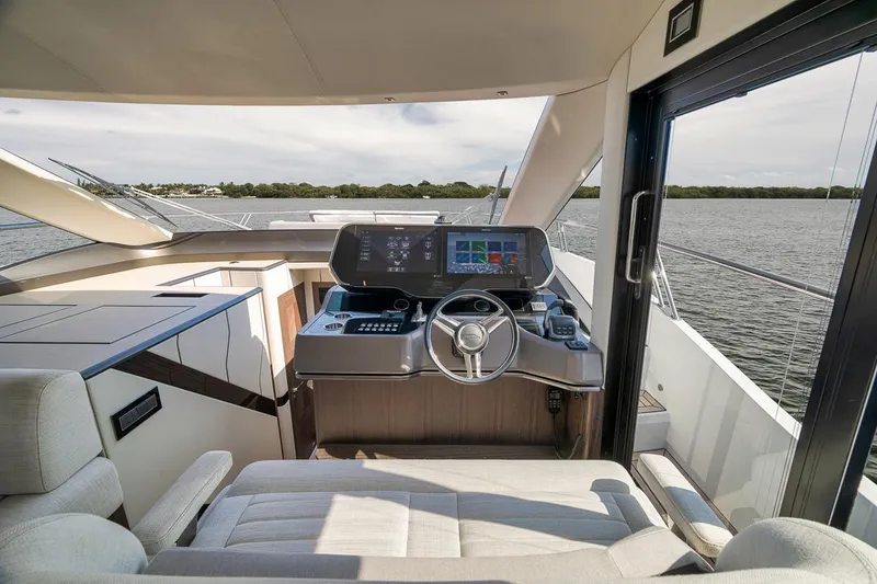 Slide: The Image of Luxurious helm of 2022 Galeon 560 Fly yacht with modern navigation system. - 32
