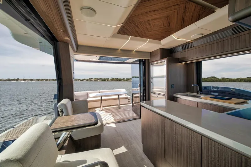 Slide: The Image of Luxurious interior of 2022 Galeon 560 Fly yacht with modern kitchen and scenic water view. - 43