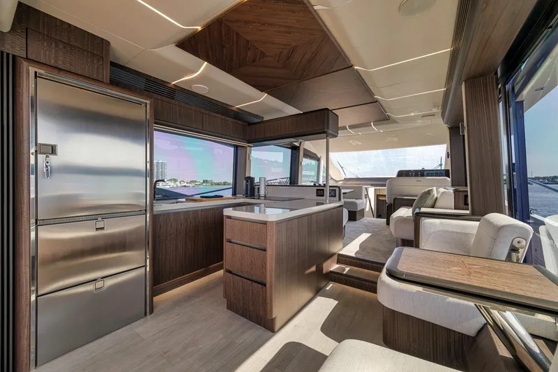 Slide: The Image of Luxurious interior of 2022 Galeon 560 Fly yacht with modern kitchen and seating area. - 39