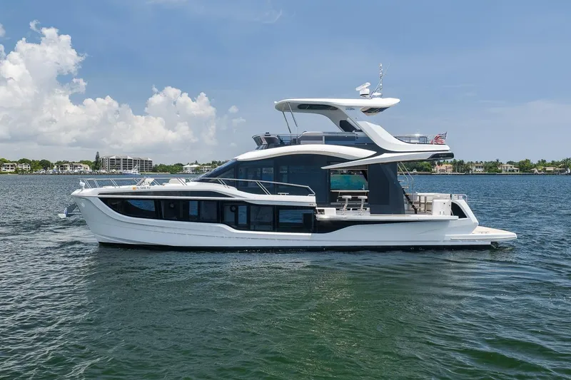 Slide: The Image of 2022 Galeon 560 Fly yacht cruising on a sunny day with clear skies. - 13