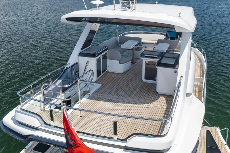 Slide: The Image of 2022 Galeon 560 Fly yacht with spacious deck and modern amenities on open water. - 18