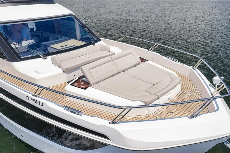 Slide: The Image of 2022 Galeon 560 Fly yacht with spacious sun deck on calm water. - 25