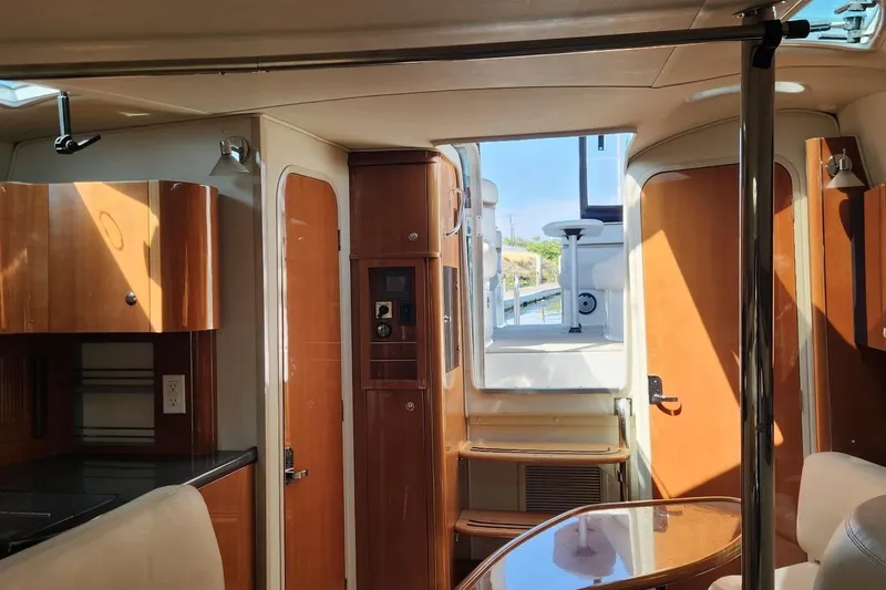 Slide: The Image of Interior of a 2006 Doral Elegante yacht with wooden cabinetry and seating. - 8