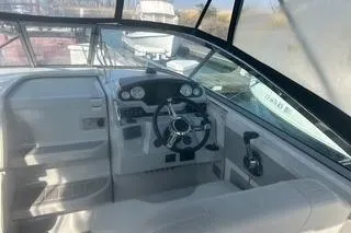 Slide: The Image of 2006 Doral Elegante boat cockpit with steering wheel and control panel. - 4