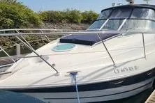 Slide: The Image of 2006 Doral Elegante boat docked, featuring sleek design and spacious deck. - 2