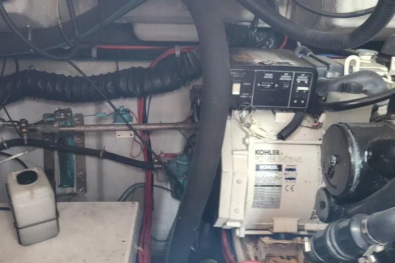 Slide: The Image of Engine room of a 2006 Doral Elegante boat featuring Kohler power systems. - 17
