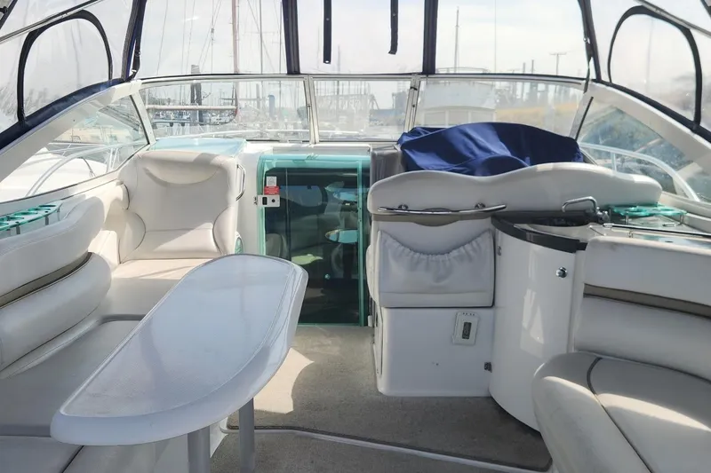 Slide: The Image of Interior of a 2006 Doral Elegante boat with white seating and a sleek design. - 5
