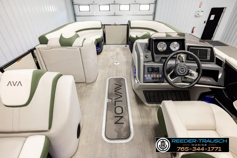 Slide: The Image of Interior view of 2024 Avalon CAT VRB pontoon boat with modern dashboard and seating. - 17