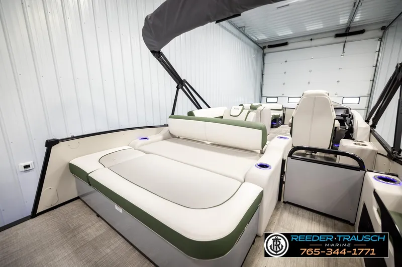 Slide: The Image of 2024 Avalon CAT VRB boat interior with plush seating in a spacious garage. - 28