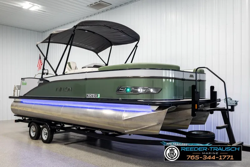 Slide: The Image of 2024 Avalon CAT VRB pontoon boat on trailer in indoor showroom. - 3