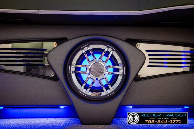 Slide: The Image of 2024 Avalon CAT VRB speaker system with blue LED lighting, Reeder-Trausch Marine branding. - 45