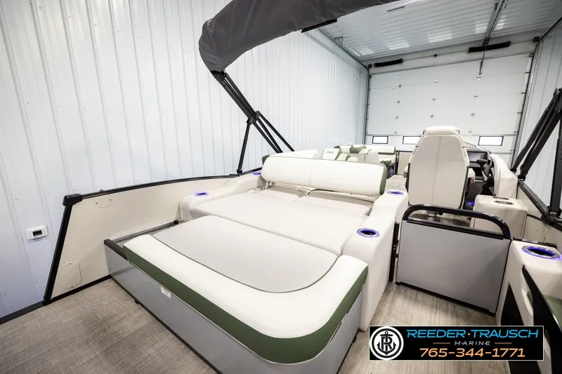 Slide: The Image of 2024 Avalon CAT VRB boat interior with plush seating in a spacious garage setting. - 30