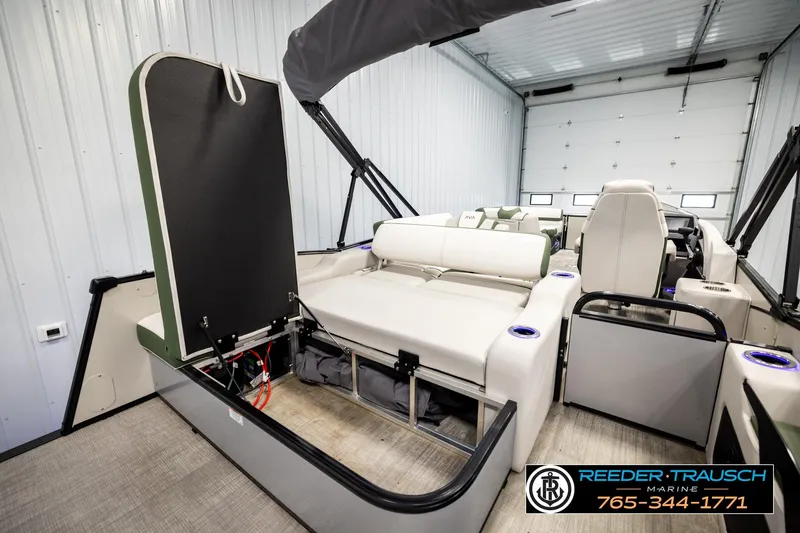 Slide: The Image of 2024 Avalon CAT VRB boat interior with seating and storage, showcased in a spacious garage. - 31