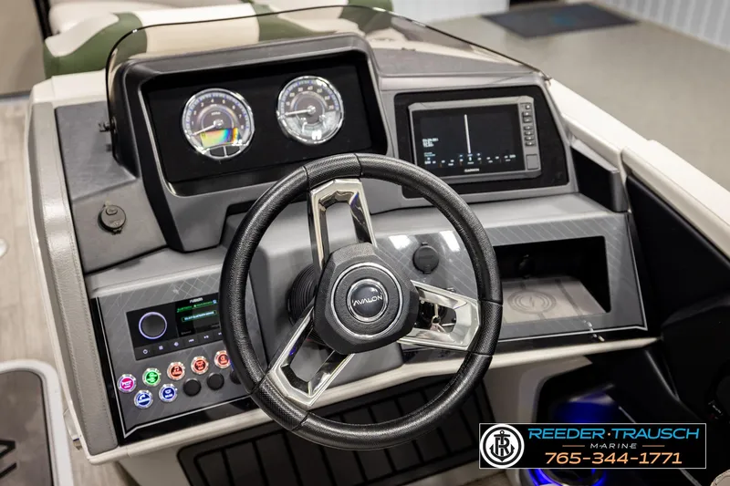 Slide: The Image of 2024 Avalon CAT VRB boat dashboard with steering wheel and digital controls. - 33