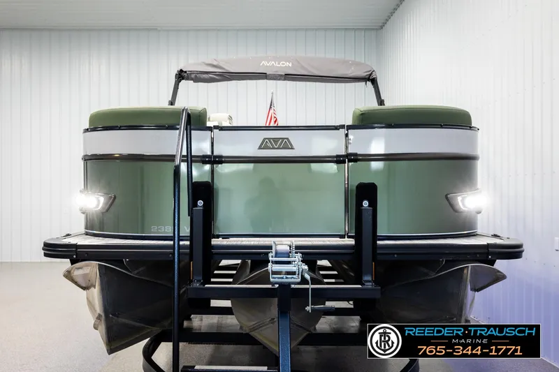 Slide: The Image of 2024 Avalon CAT VRB pontoon boat in showroom, featuring sleek design and modern lighting. - 8