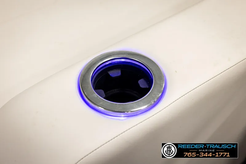Slide: The Image of Illuminated cup holder on 2024 Avalon CAT VRB boat, featuring sleek design and blue lighting. - 49