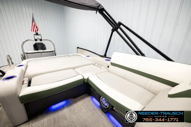 Slide: The Image of 2024 Avalon CAT VRB boat interior with plush seating and ambient blue lighting. - 24