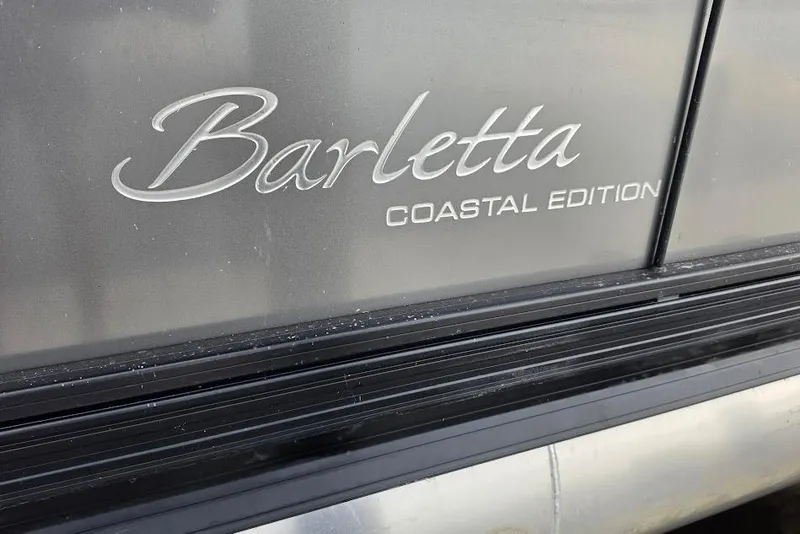 Slide: The Image of Barletta Coastal Edition logo on 2022 Cabrio 24UE boat exterior. - 28