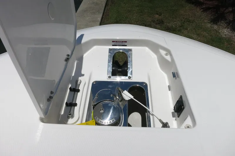 Slide: The Image of Open storage compartment on 2026 Robalo R250 Center Console boat. - 30