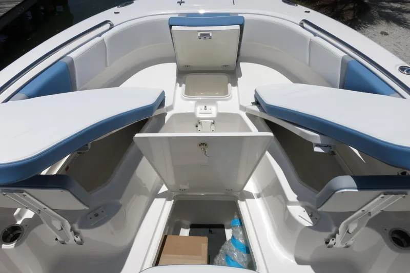 Slide: The Image of 2026 Robalo R250 Center Console boat interior with open storage compartments and seating. - 29