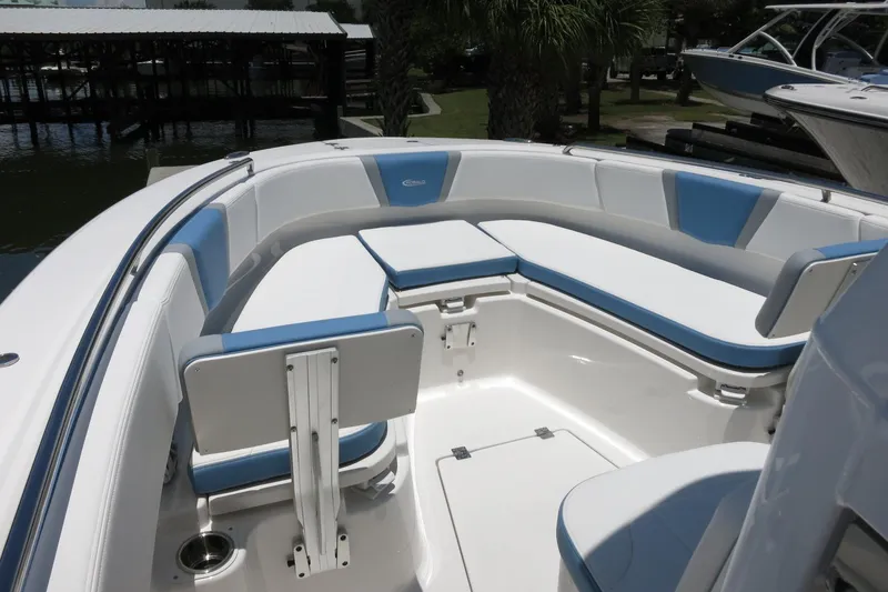 Slide: The Image of 2026 Robalo R250 Center Console boat interior with blue and white seating. - 27