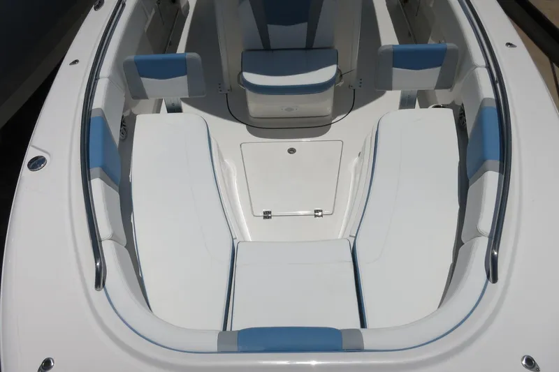 Slide: The Image of 2026 Robalo R250 Center Console boat interior with white and blue seating. - 31