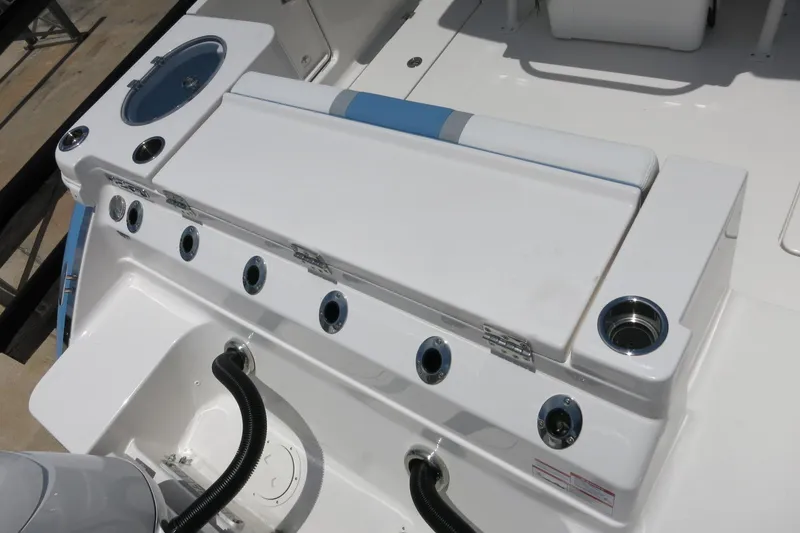 Slide: The Image of 2026 Robalo R250 Center Console boat deck with seating and storage compartments. - 10