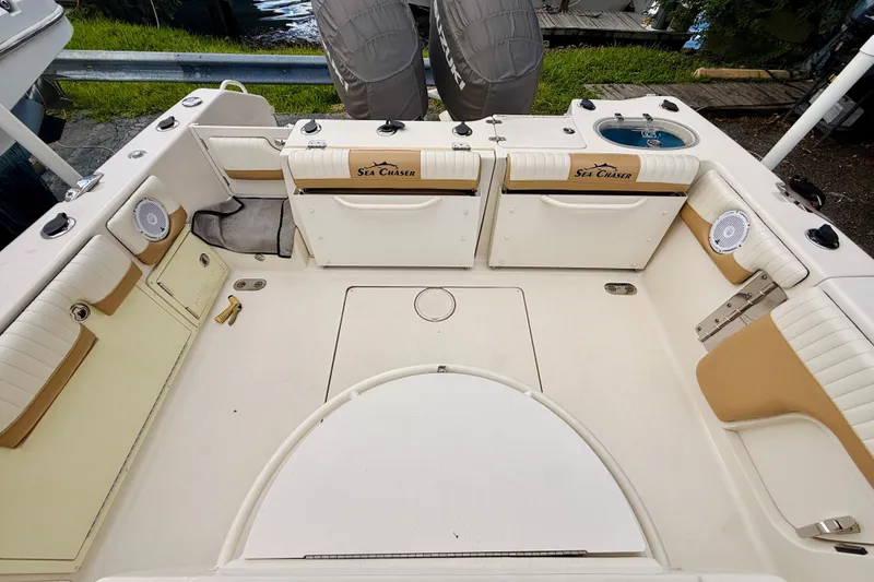 Slide: The Image of 2018 Sea Chaser 27 HFC CC boat interior with seating and storage compartments. - 17