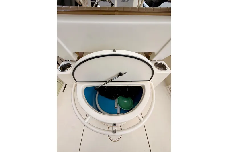 Slide: The Image of 2018 Sea Chaser 27 HFC CC boat interior storage compartment with cup holders. - 23