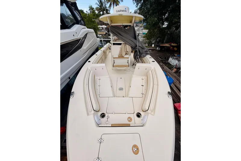 Slide: The Image of 2018 Sea Chaser 27 HFC CC boat with Garmin equipment, docked outdoors. - 39