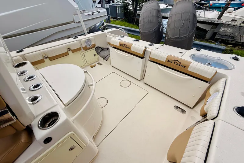 Slide: The Image of 2018 Sea Chaser 27 HFC CC boat interior with seating and storage compartments. - 16