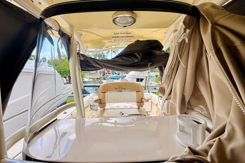 Slide: The Image of 2018 Sea Chaser 27 HFC CC boat interior with seating and canopy. - 32