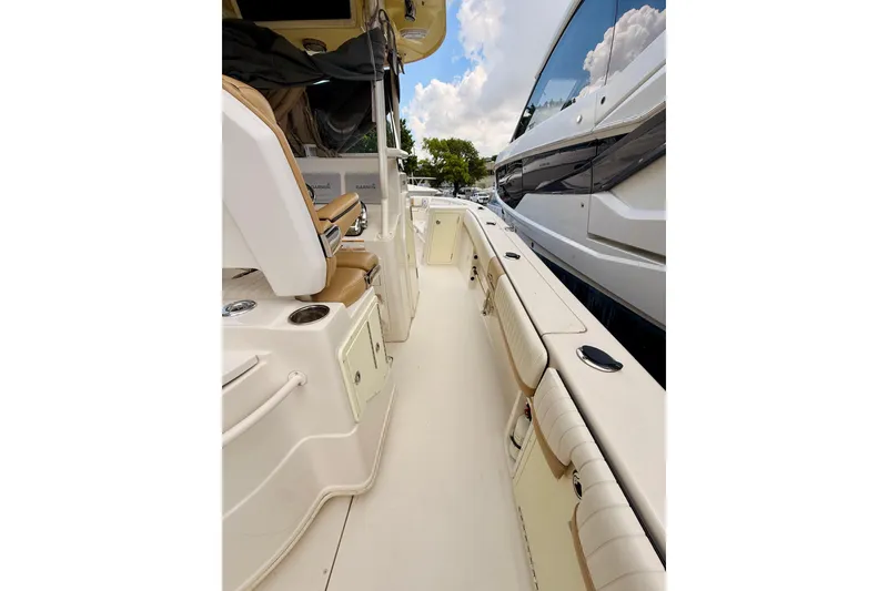 Slide: The Image of 2018 Sea Chaser 27 HFC CC boat interior with seating and storage compartments. - 33
