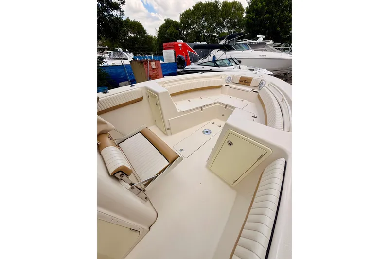 Slide: The Image of 2018 Sea Chaser 27 HFC CC boat interior with seating and storage compartments. - 34