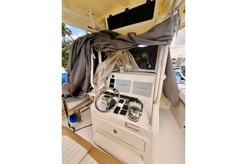 Slide: The Image of 2018 Sea Chaser 27 HFC CC boat dashboard with Garmin navigation system. - 27