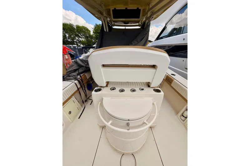 Slide: The Image of 2018 Sea Chaser 27 HFC CC boat interior with seating and storage compartments. - 21