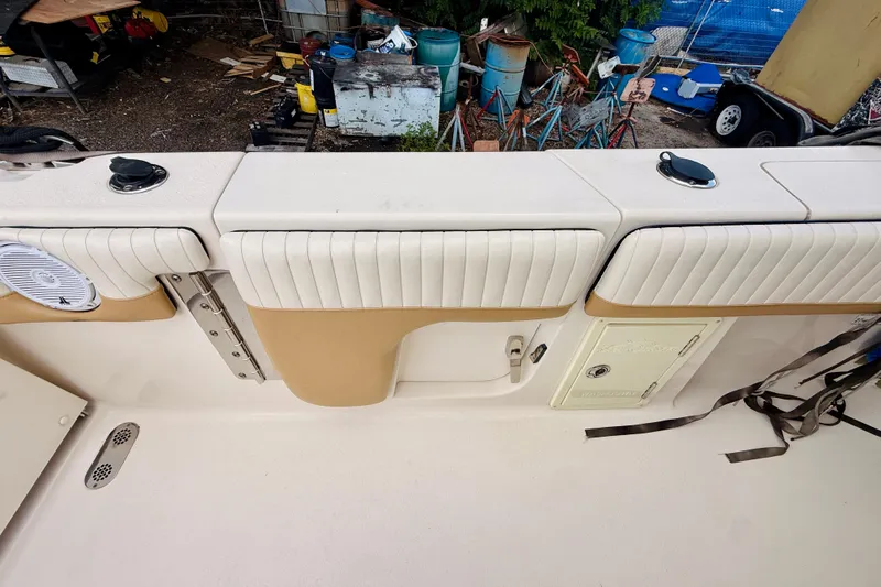 Slide: The Image of 2018 Sea Chaser 27 HFC CC boat interior with white and tan seating. - 24