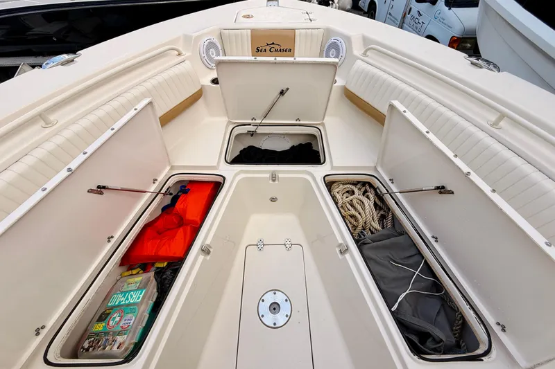 Slide: The Image of 2018 Sea Chaser 27 HFC CC boat with open storage compartments and safety gear. - 36