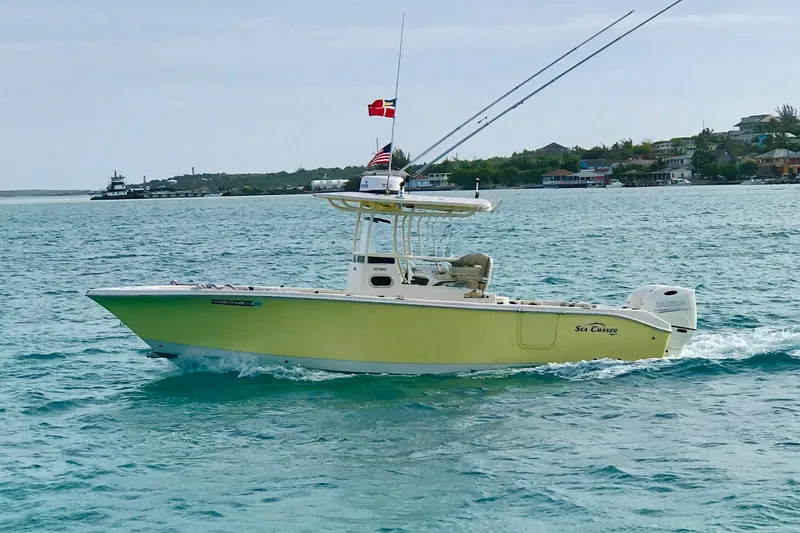 Slide: The Image of 2018 Sea Chaser 27 HFC CC boat cruising on blue ocean waters. - 1