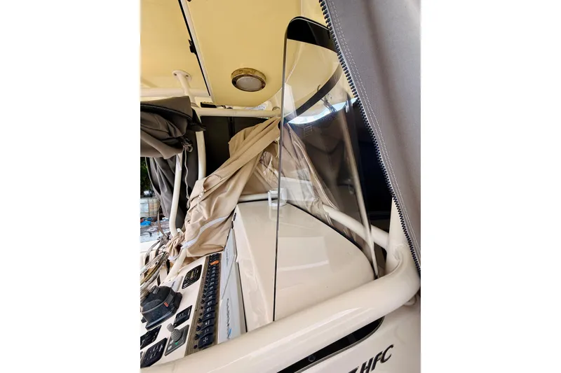 Slide: The Image of 2018 Sea Chaser 27 HFC CC boat interior with console and protective cover. - 31