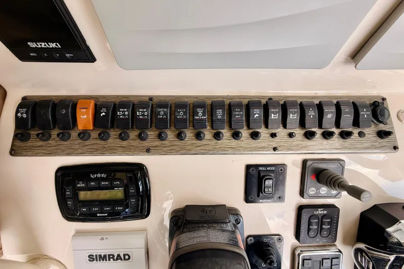 Slide: The Image of Control panel of a 2018 Sea Chaser 27 HFC CC boat with switches and electronics. - 30