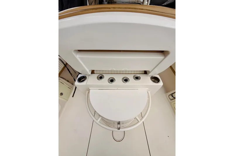 Slide: The Image of 2018 Sea Chaser 27 HFC CC boat interior with cup holders and seating area. - 22