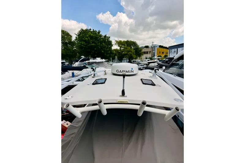 Slide: The Image of 2018 Sea Chaser 27 HFC CC boat with Garmin equipment, docked under a cloudy sky. - 40