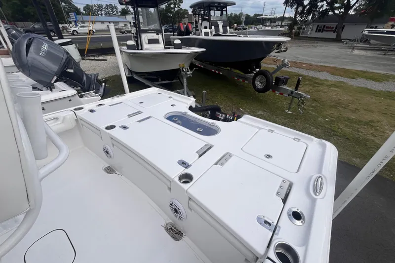 Slide: The Image of 2027 Tidewater 2500 Carolina Bay boat with Yamaha engine, displayed outdoors. - 4